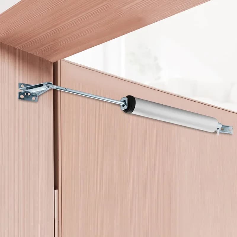 Ferme-porte automatique à ressort